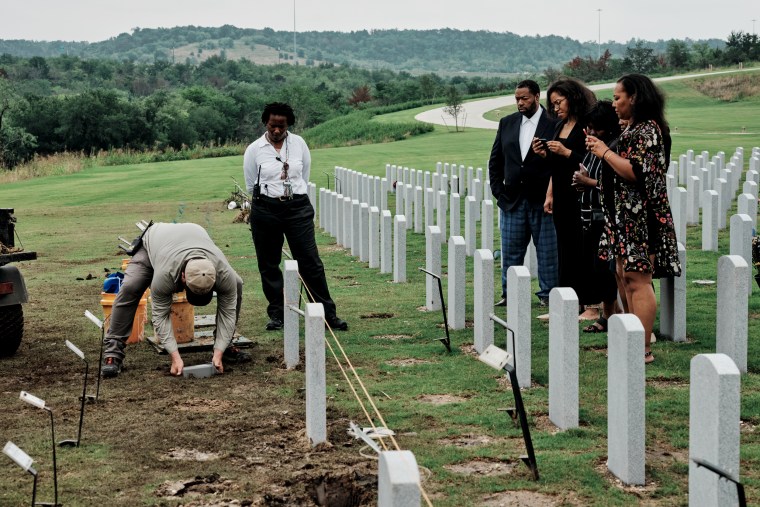 Victor Honey's family attends a burial service.