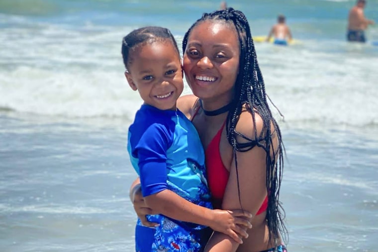 Amber Thurman and her son hug at the beach