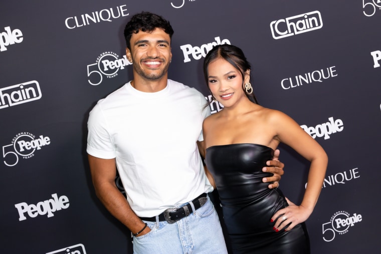 Jonathon Johnson, left, and Jenn Tran pose together for a photo on the red carpet