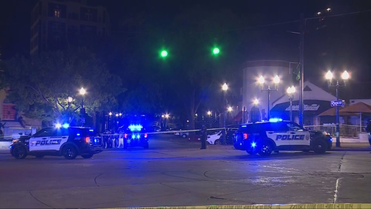 Birmingham police vehicles near the scene where multiple people were shot late Saturday.