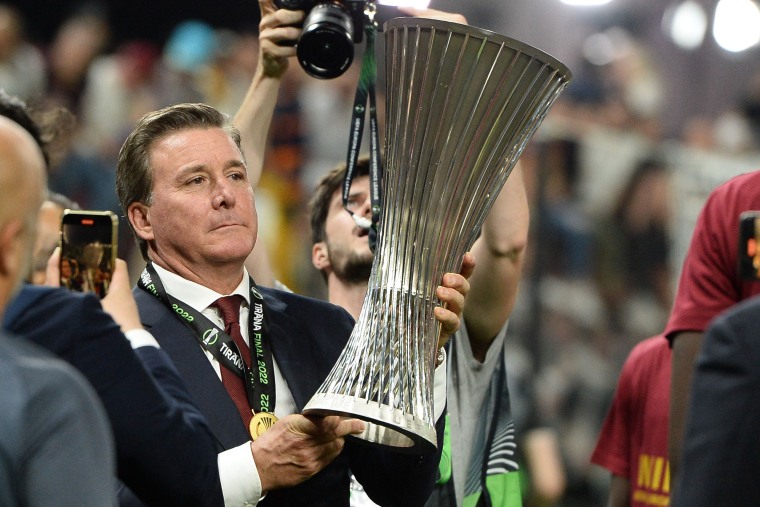 Dan Friedkin of AS Roma celebrates with the Europe Conference League Trophy in 2022.