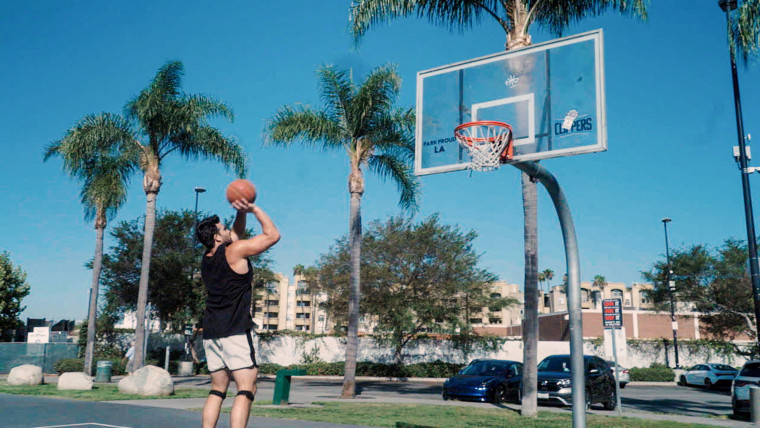 Hassan Picker is playing basketball outside