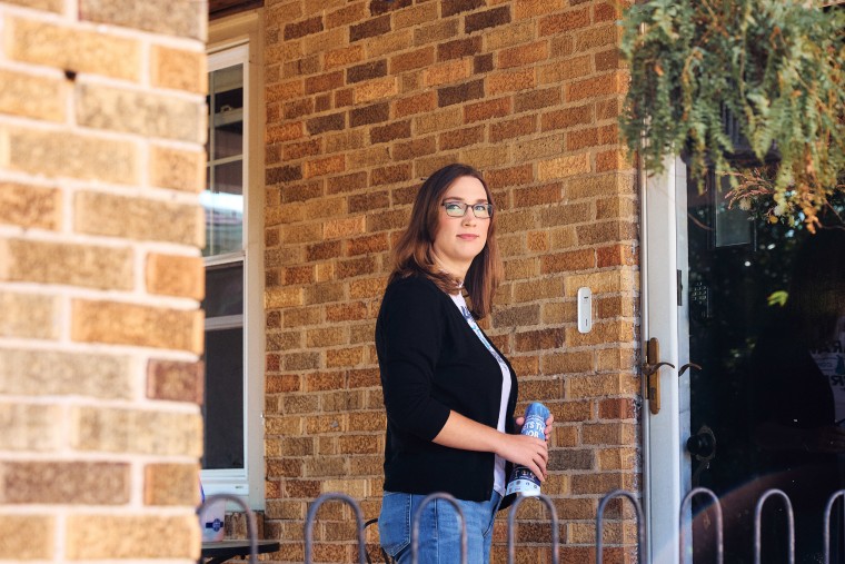  Sarah McBride with campaign literature at the door of a Wilmington home on Sept. 9.