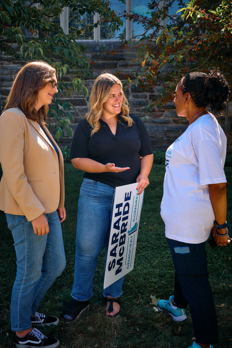 Taylor Hawk and McBride speak to a supporter