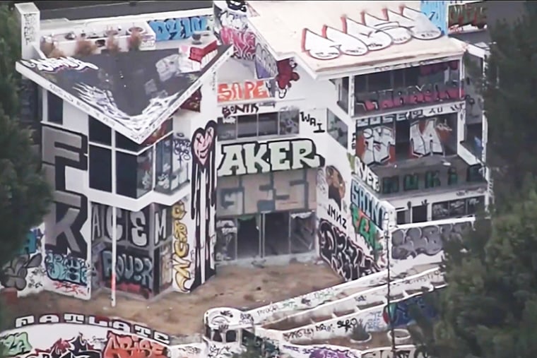 Two abandoned mansions owned by a Hollywood producer are covered in grafitti