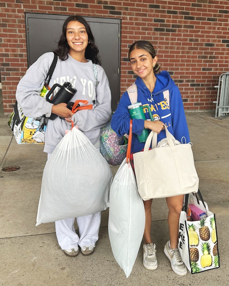 Maya Malouin and Nitya Katwala with their belongings