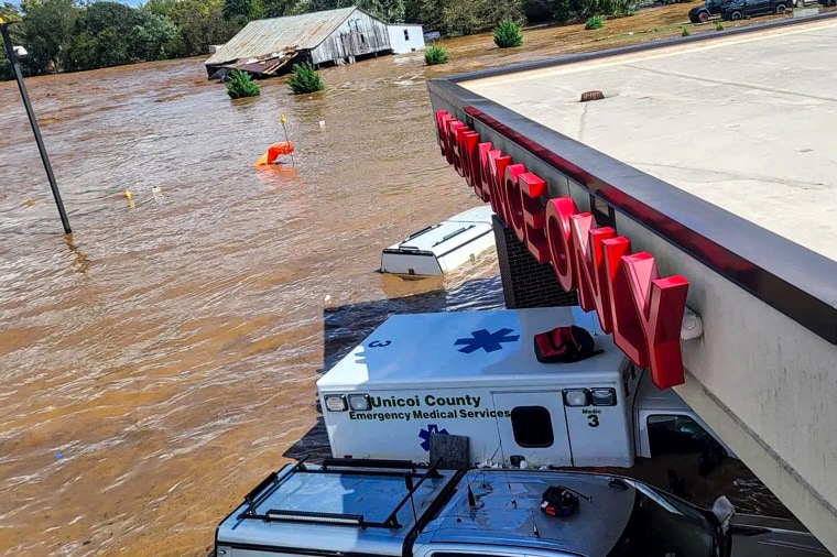 People evacuate Unicoi County Hospital due to unusually high and rising water from the Nolichucky River.