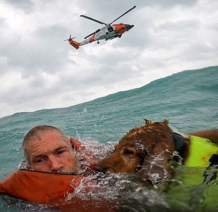 A man and his dog are rescued after his sailboat became disabled during Hurricane Helene approximately 25 miles off Sanibel Island, Fla., on Thursday, Sept. 26, 2024. 