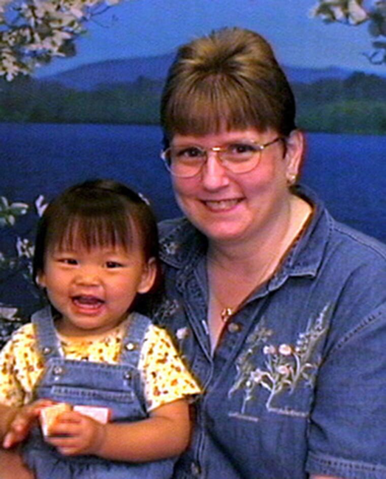 Katelyn Monaco as a small child and her adoptive mother.