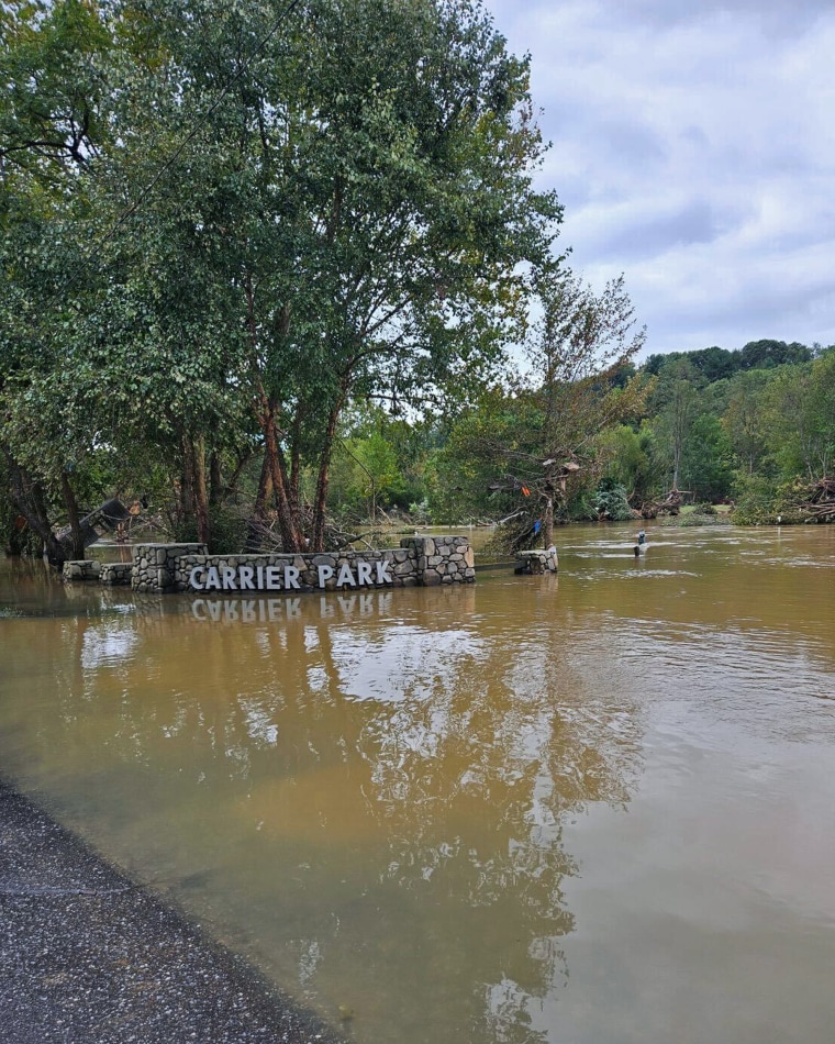 Streets remain flooded and trees are down in Asheville, N.C., on Sunday.