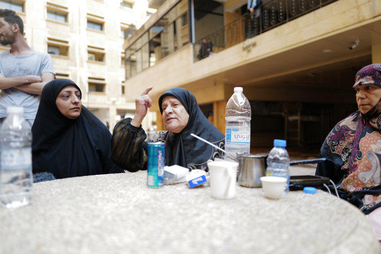 Residents gather on Monday after an Israeli airstrike in central Beirut. 