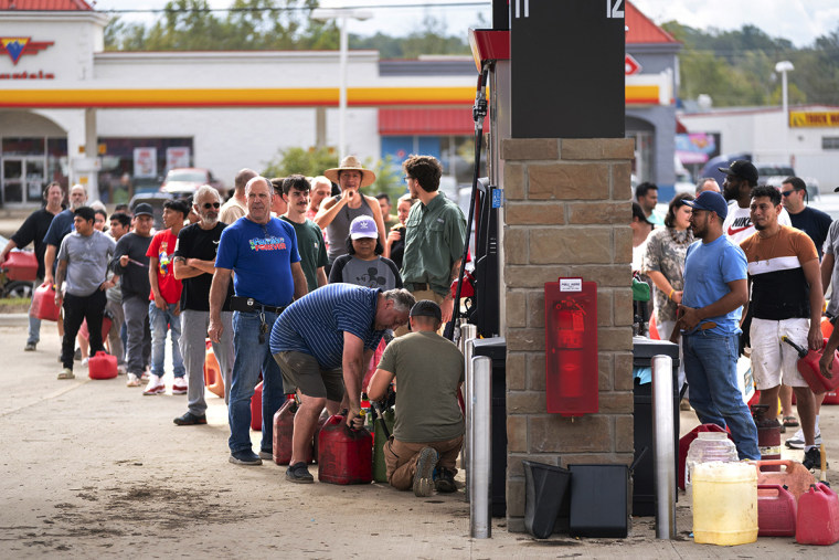 People wait in line to pump gasoline on Sept. 29, 2024 in Fletcher, N.C.