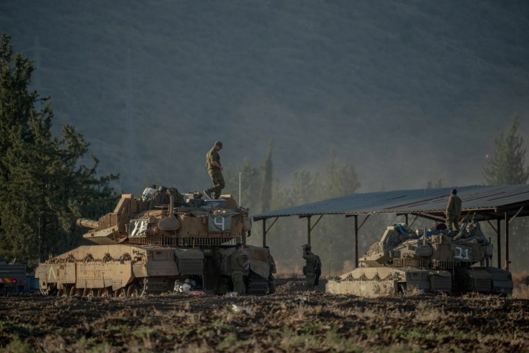 Israeli tanks and APC's gathered at the border