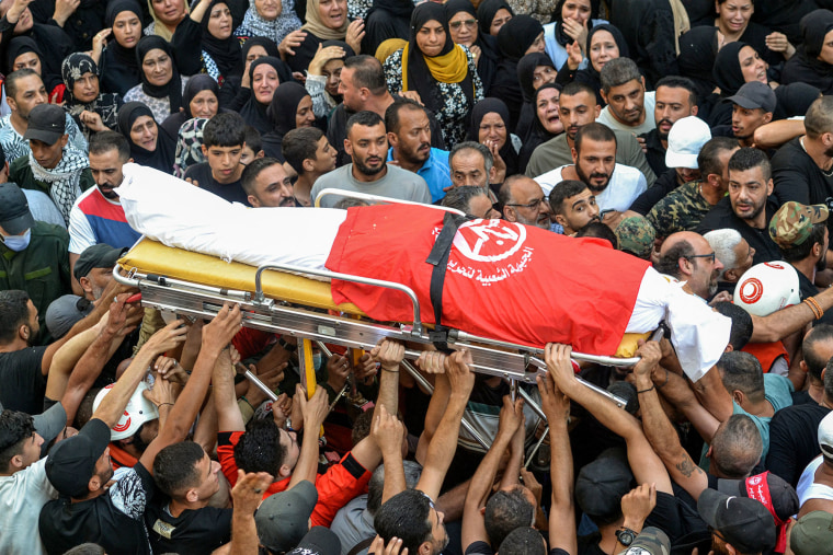 Mourners gather for the funeral 