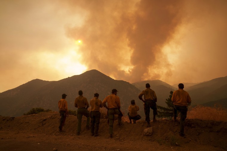 Bombers observed the advance of the fire line in Angelus Oaks, California, on September 9, 2024. 