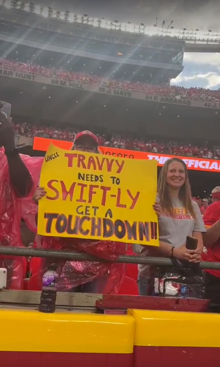 A sign at the Chiefs game for Travis Kelce that features a Taylor Swift reference.