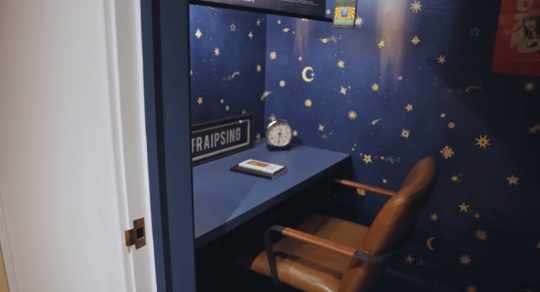 A small desk with a leather chair.