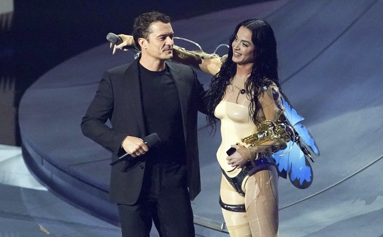 Katy Perry hugs Orlando Bloom after her performance at the MTV Video Music Awards.