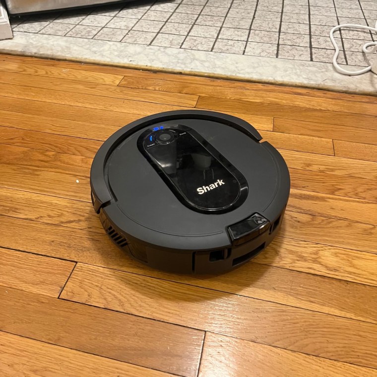 Shark robot vacuum on hardwood floor