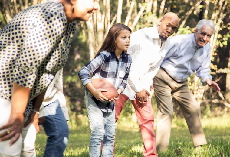 family playing football 