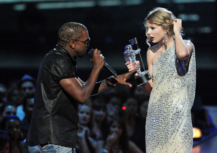 Kayne West jumps onstage as Taylor Swift accepts her award for the "Best Female Video" award during the 2009 MTV VMA's.