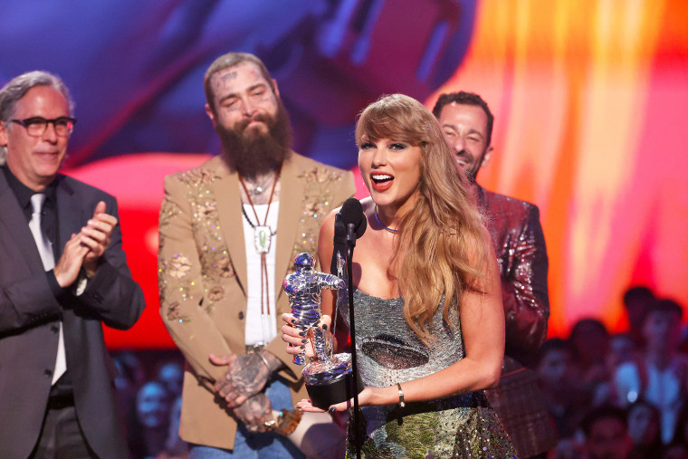 Taylor Swift, with Rodrigo Prieto, Post Malone, and Ethan Tobman, accepts the Video of the Year award for "Fortnight" during the 2024 MTV Video Music Awards.