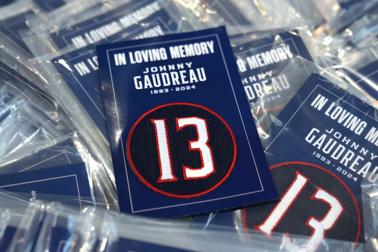 Patch number 13 honoring Johnny Gaudreau distributed to fans before the game between the Columbus Blue Jackets and the Florida Panthers at Nationwide Arena on October 15, 2024 in Columbus, Ohio. 