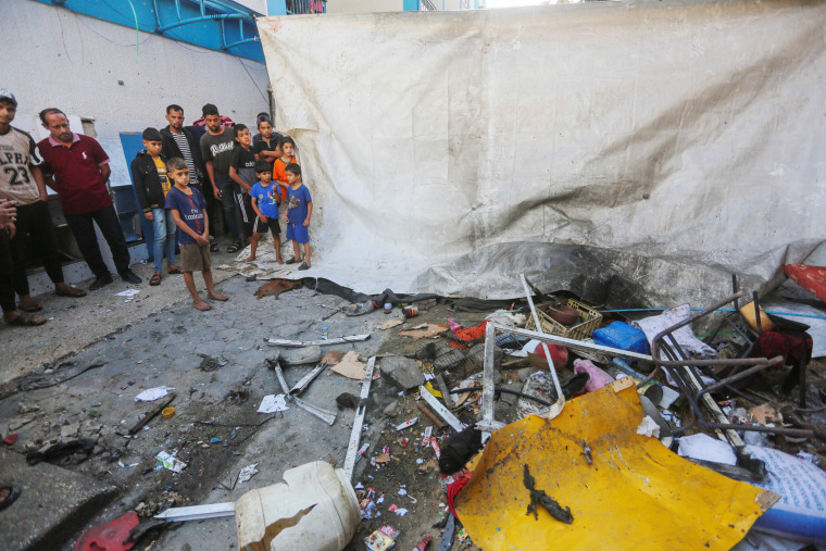 Debris in the courtyard of Nuseirat Girls High School after Israeli attacks