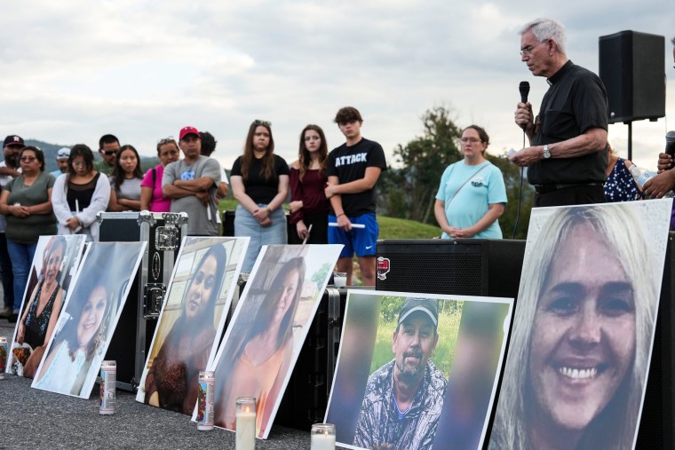 Rev. Tom Charters, speaks during a vigil, where enlarged photos of the victims are set up before him. From right, are portraits of Sibrina Barnett, Johnny Peterson, Lydia Verdugo, Rosa Maria Adrade Reynoso, Monica Hernandez Coron, and Bertha Mendoza.