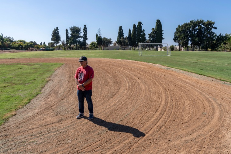Yehuda Beinin at the baseball field in Kibbutz Shomrat.