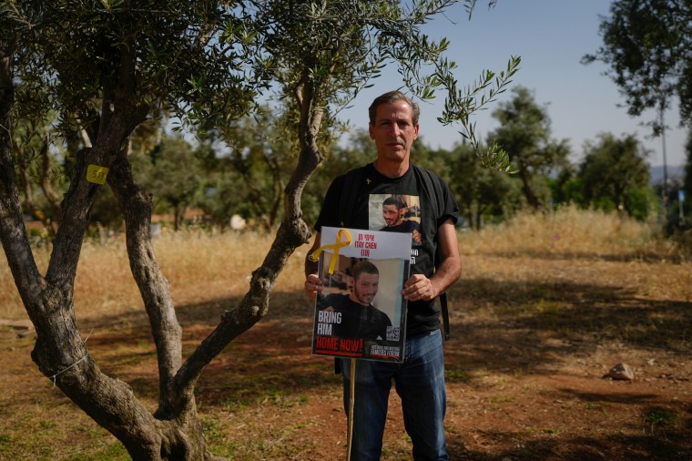 Ruby Chen with a poster of his son Itay Chen during a protest near Israel’s parliament in Jerusalem in March.