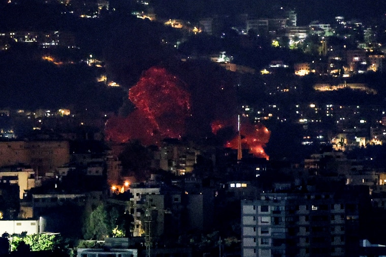 Smoke billows over Beirut's southern suburbs after a strike, amid ongoing hostilities between Hezbollah and Israeli forces