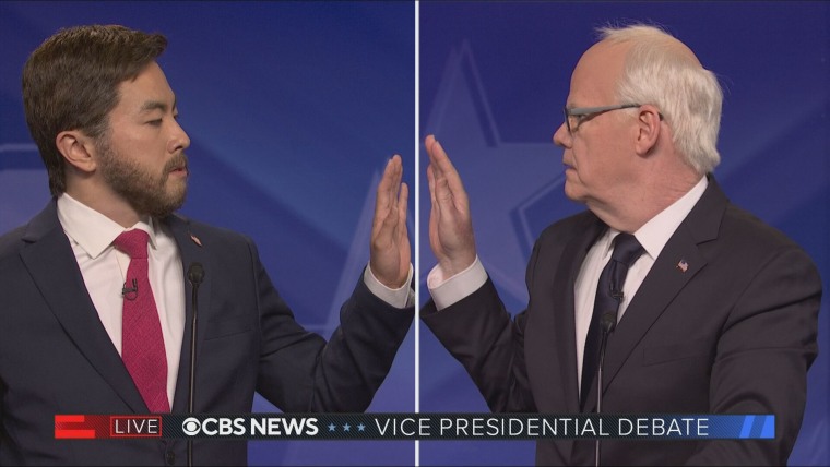 Bowen Yang as Sen. JD Vance, left, and Jim Gaffigan as Gov. Tim Walz on "Saturday Night Live" on Oct. 5, 2024.