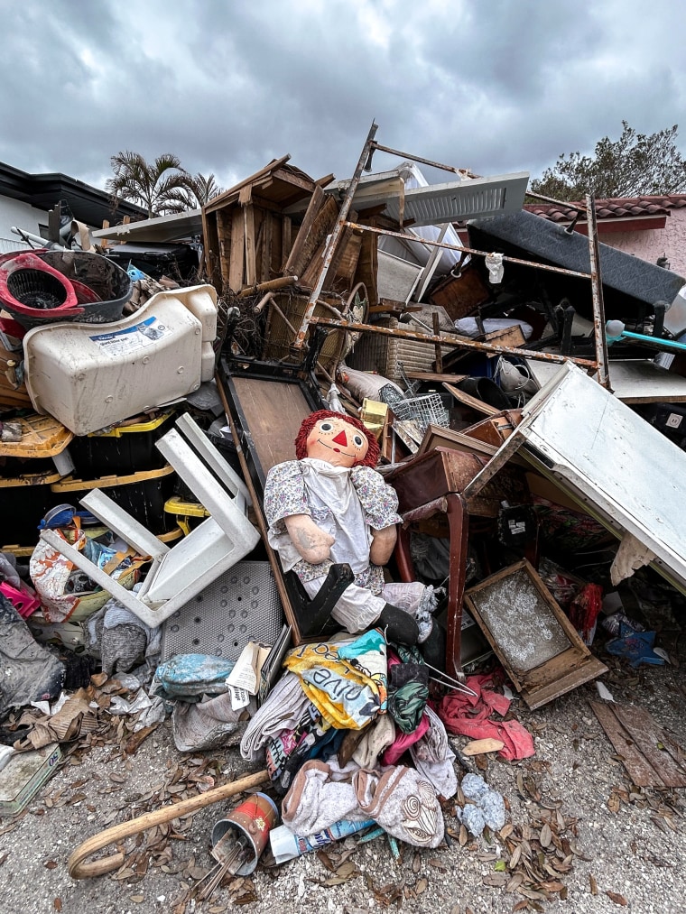 John and Rhonda Keigher’s belongings lay outside their Madeira Beach home.