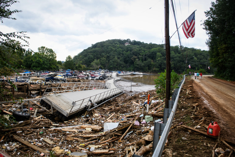 A lake on the side of a road is filled with debris