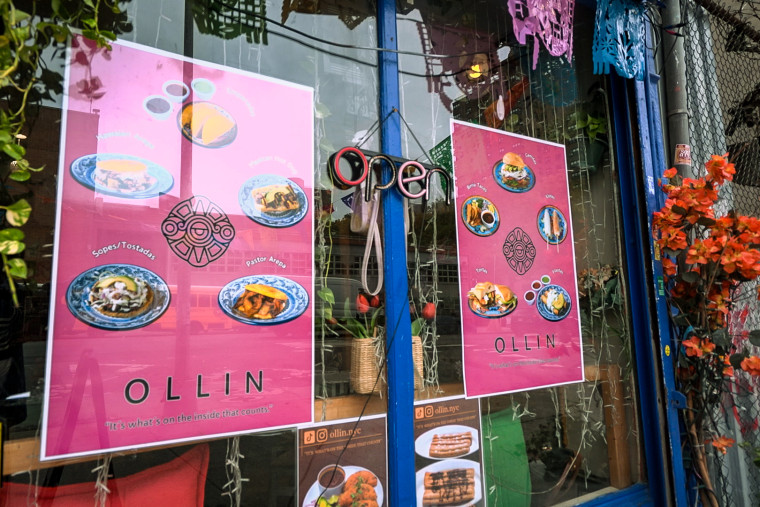 Some of Olin's specials and menu items are displayed in the front window.