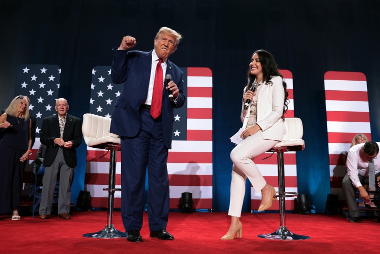 Former President Donald Trump  and moderator Rep. Anna Paulina Luna.