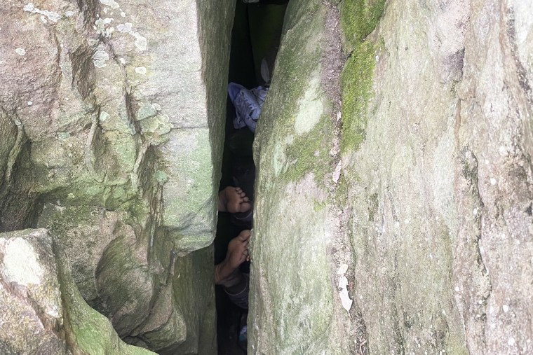 The woman required a complicated rescue operation to free her from a small gap between two boulders.