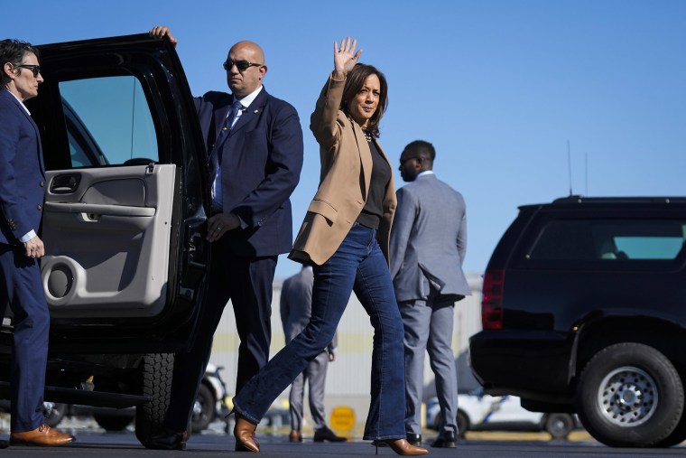 Vice President Kamala Harris Vice waves as she walks to board Air Force Two