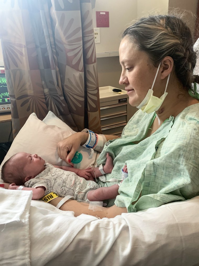 Becky Munge holds Jovie in the hospital.