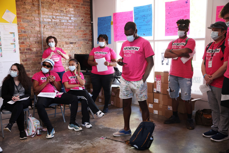 Advocates with Planned Parenthood organize before dispersing to knock on doors in North Carolina.