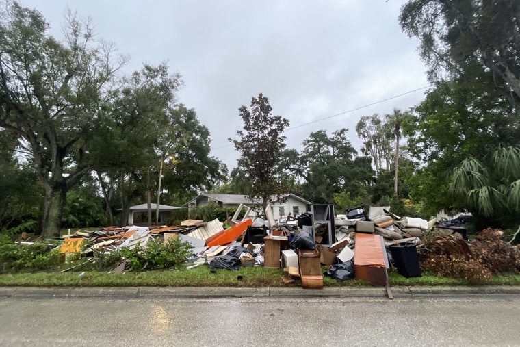 The contents of homes damaged by flooding from Hurricane Helene pile up on the side of the road ahead of Hurricane Milton in Tampa, Florida.