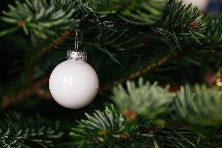 White bauble on a Christmas tree