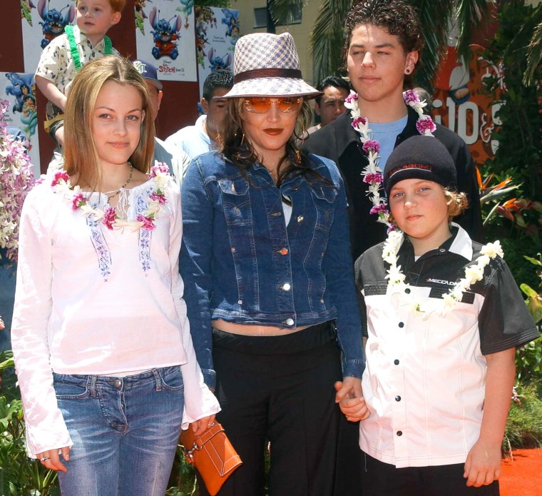 Lisa Marie Presley and her children Benjamin Keough (R),  Riley Keough (L), and her half-brother Navarone Garibaldi (back) on June 16, 2002 in Hollywood, CA.