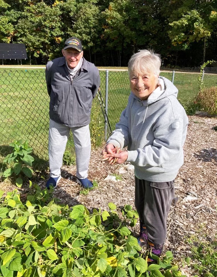 David Scott and his wife gardening.