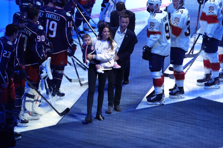 Meredith Gaudreau steps onto the ice during a memorial service for her husband, Columbus Blue Jackets player Johnny Gaudreau, before the home game against the Florida Panthers at Nationwide Arena on October 15, 2024 in Columbus, Ohio. 