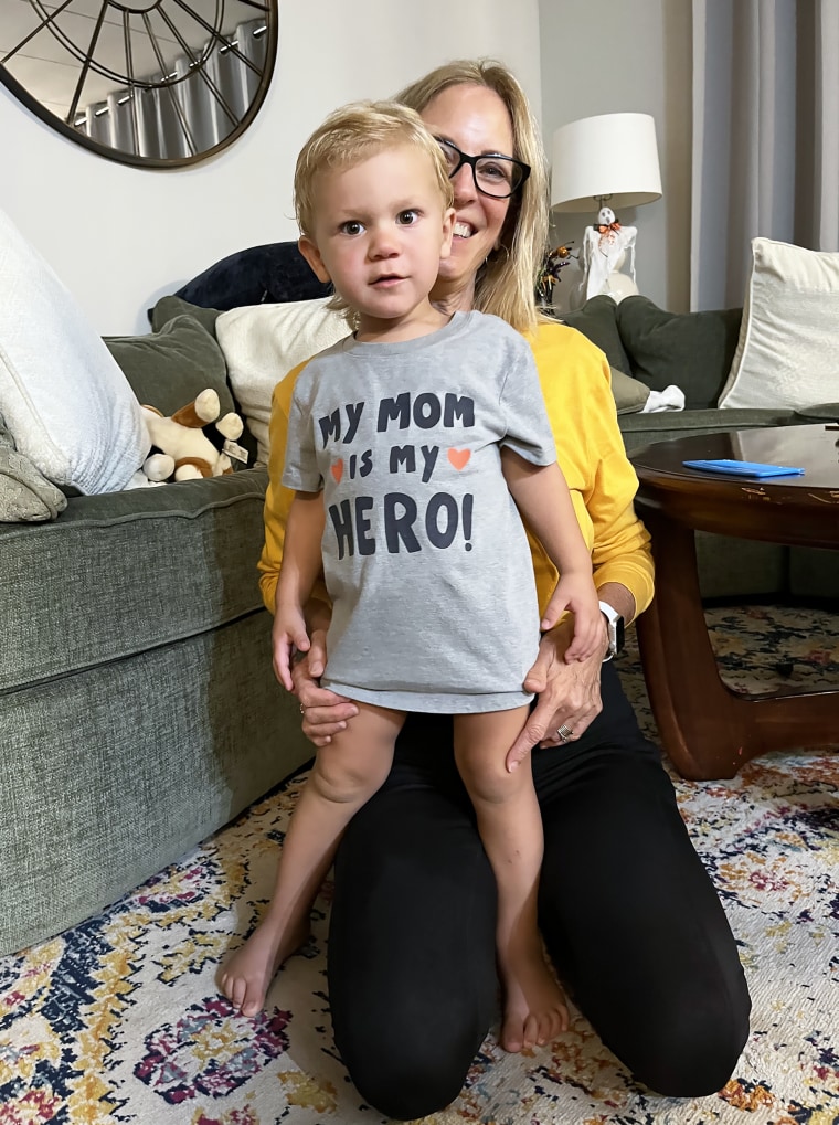 When Emily Bond received her biopsy results, her son Atlas was 'scribbling on the carpet,' unaware that his mom received devastating news.