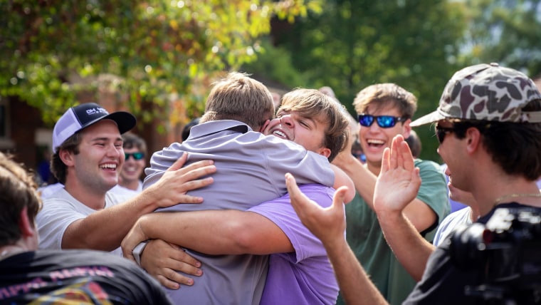 Charlie McGee and Zach Freeman hugged on trading day. 