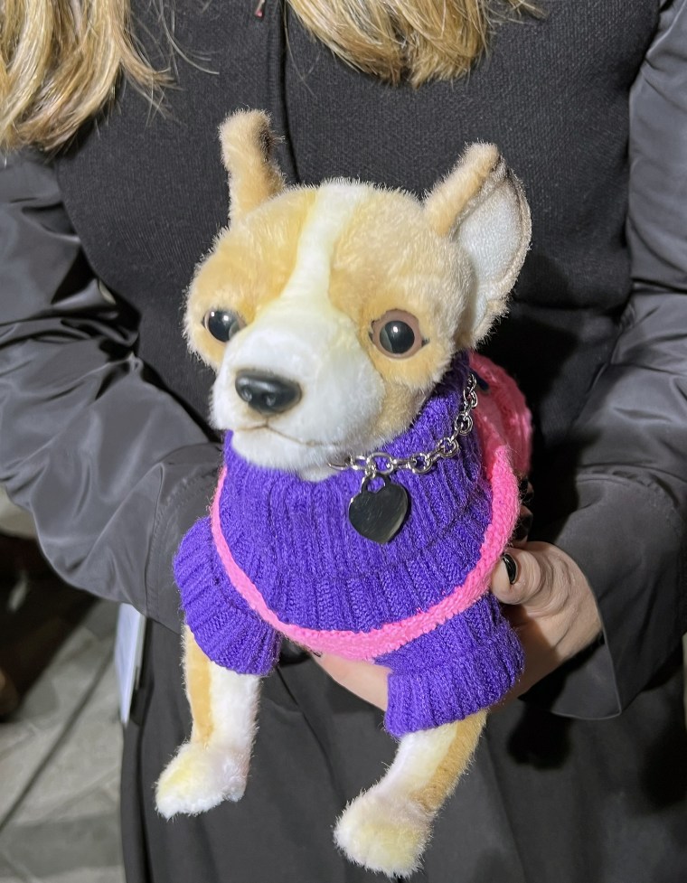 TODAY costume designer Staci Greenbaum poses with a stuffed Bruiser dog before the unveiling of the Legally Blonde costume.