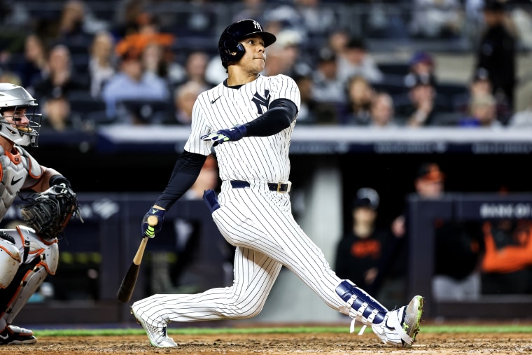 Juan Soto, #22 of the New York Yankees, hits a two-run home run at Yankee Stadium in New York on September 25, 2024. 